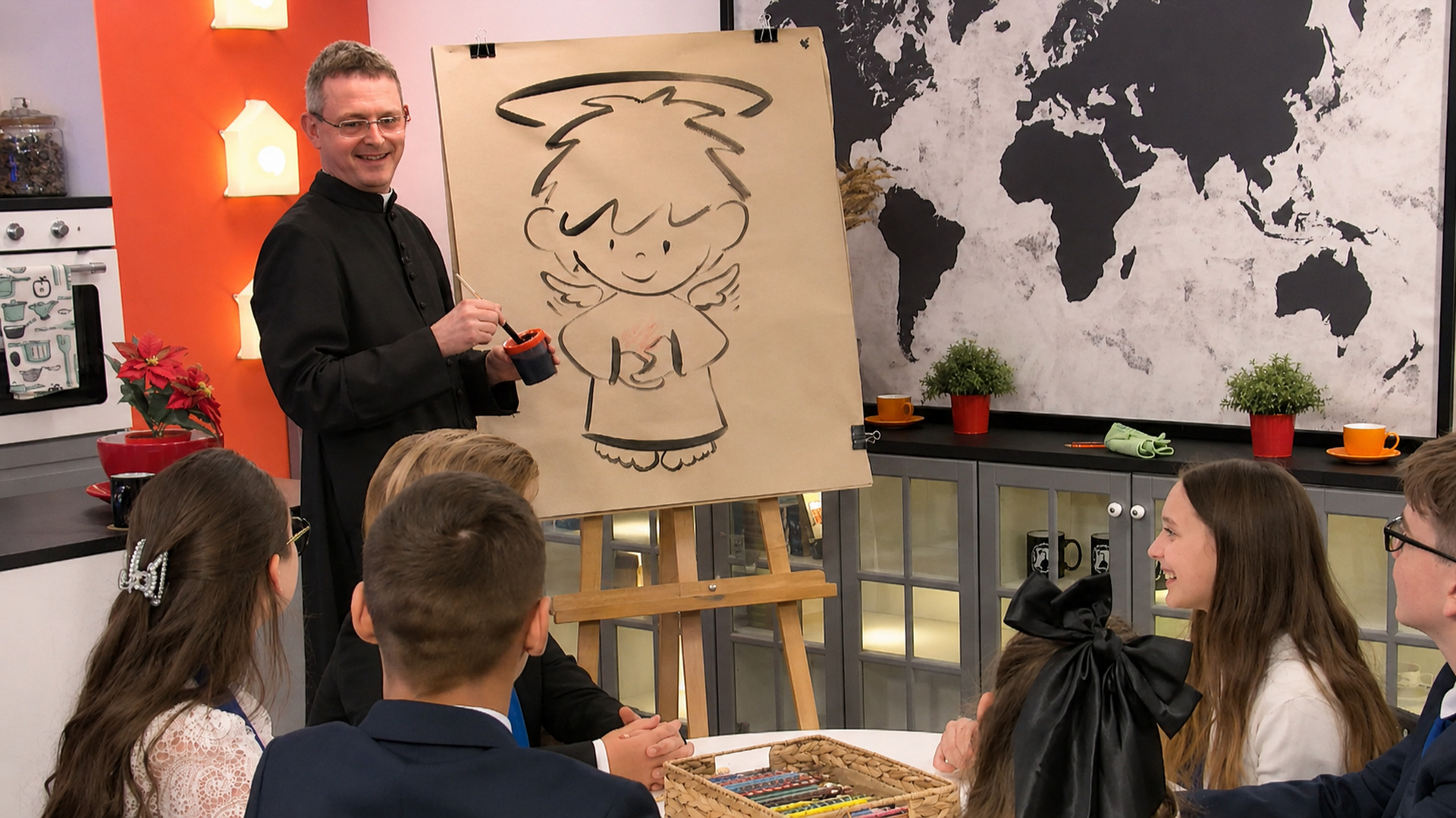 Stift Z. Angelico in the EWTN studio beside his little angel drawing